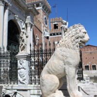 Lion statue in front of Venice Arsenal Stone lion statue