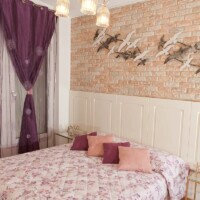 bedroom with scatter cushions on bed